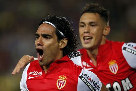 Monaco's Radamel Falcao (L) celebrates after scoring against Nantes during their French Ligue 1 soccer match at the Beaujoire in Nantes, August 24, 2014. REUTERS/Stephane Mahe