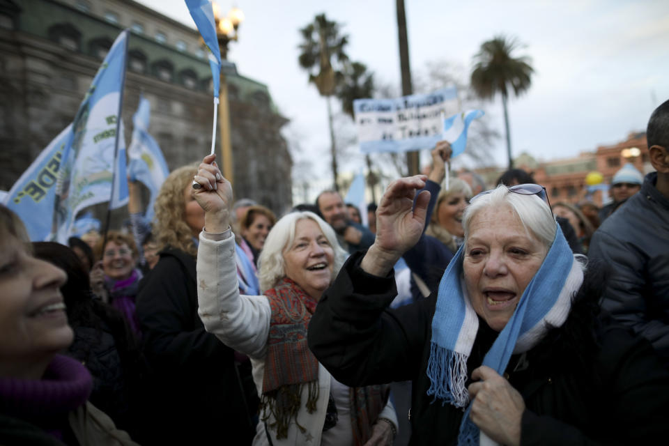 Women show their support for President Mauricio Macri, in Buenos Aires, Argentina, Saturday, Aug. 24, 2019. Following a social media campaign large numbers of people gathered in the center of Buenos Aires to show their support for Macri's administration. (AP Photo/Natacha Pisarenko)