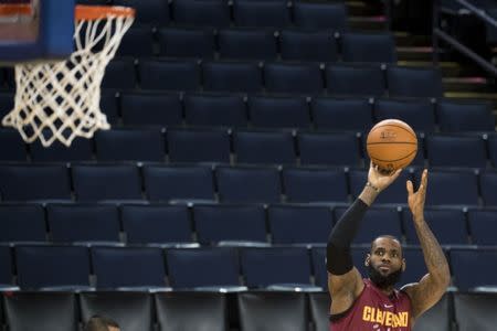 May 30, 2018; Oakland, CA, USA; Cleveland Cavaliers forward LeBron James shoots the basketball during NBA Finals media day at Oracle Arena. Mandatory Credit: Kyle Terada-USA TODAY Sports