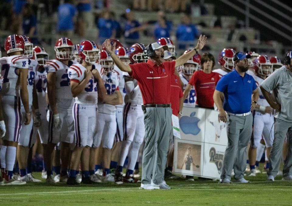 Patriots head coach Kent Smith questions a call during the Pace vs West Florida football game at West Florida High School in Pensacola on Friday, Sept. 8, 2023.