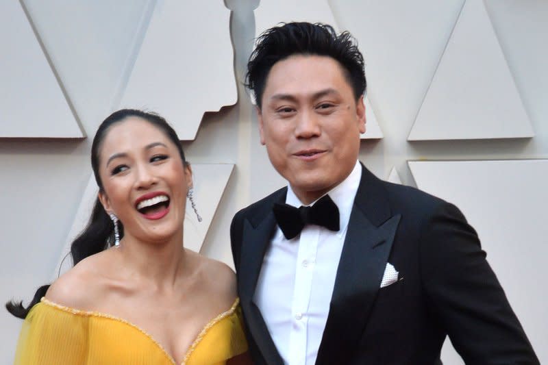 Jon M. Chu, shown with Constance Wu, directed the two-part "Wicked" movie. File Photo by Jim Ruymen/UPI