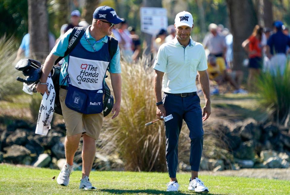 Eric Cole and his caddie walk up the eighth fairway during the third round of the Honda Classic at PGA National Resort & Spa on Saturday, February 25, 2023, in Palm Beach Gardens, FL.