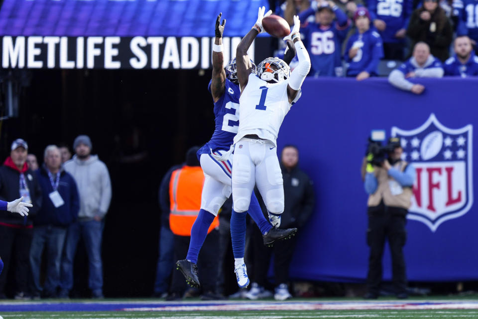 Indianapolis Colts' Parris Campbell (1) catches as pass in front of New York Giants' Xavier McKinney (29) during the first half of an NFL football game, Sunday, Jan. 1, 2023, in East Rutherford, N.J. (AP Photo/Bryan Woolston)