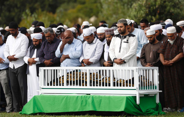 Mourners pray at the graveside of a Christchurch shooting victim. Source: AP