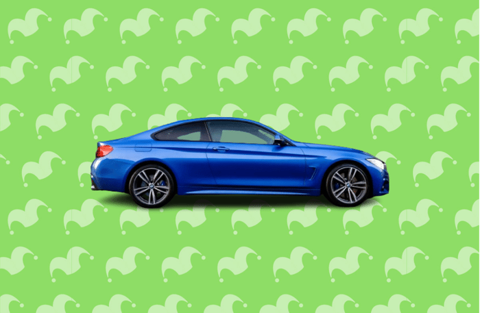 A blue sports car against a green background