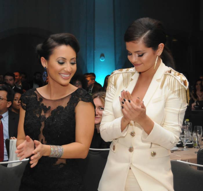 closeup of the two clapping at an event