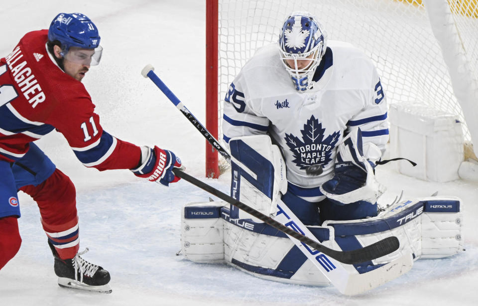 Montreal Canadiens' Brendan Gallagher tries to tip the puck past Toronto Maple Leafs goaltender Ilya Samsonov during the second period of an NHL hockey game Saturday, March 9, 2024, in Montreal. (Graham Hughes/The Canadian Press via AP)