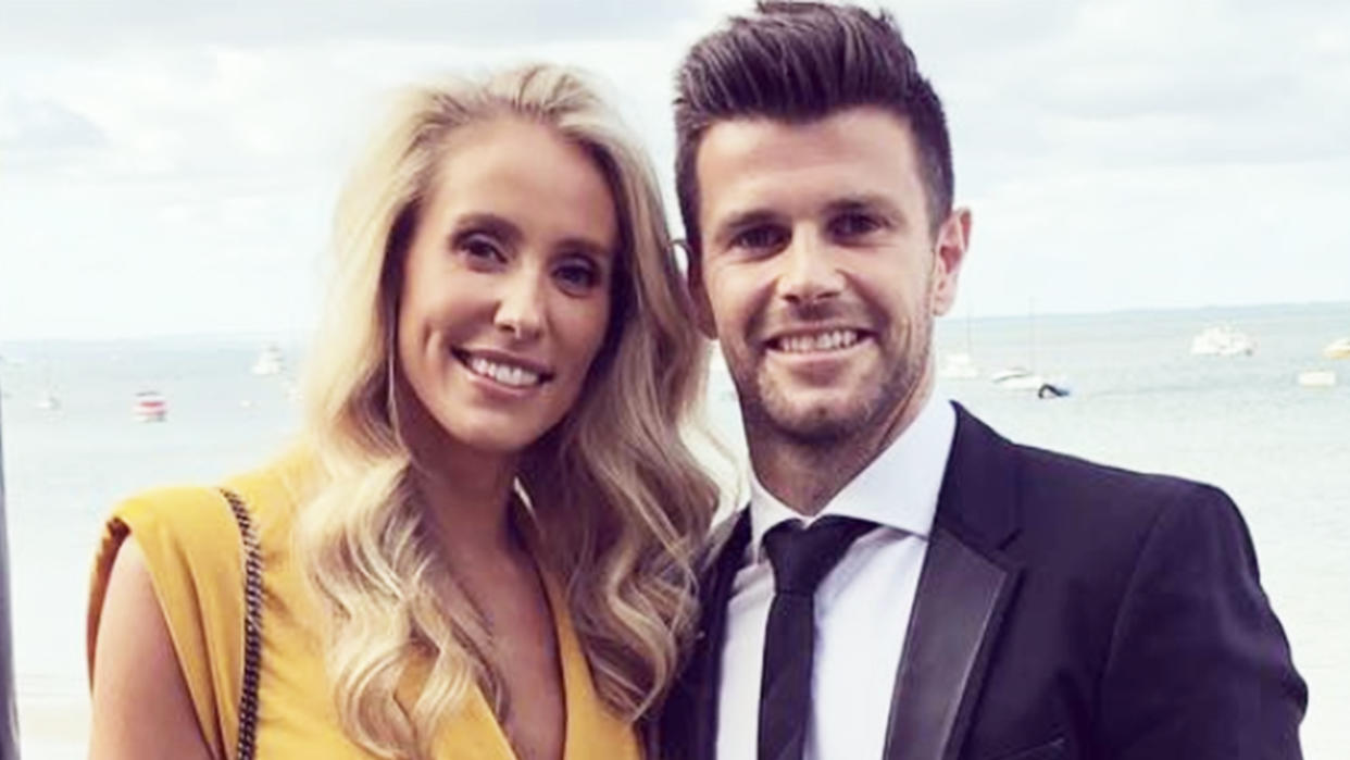 Brooke Cotchin and her husband Trent Cotchin pose for a photo.