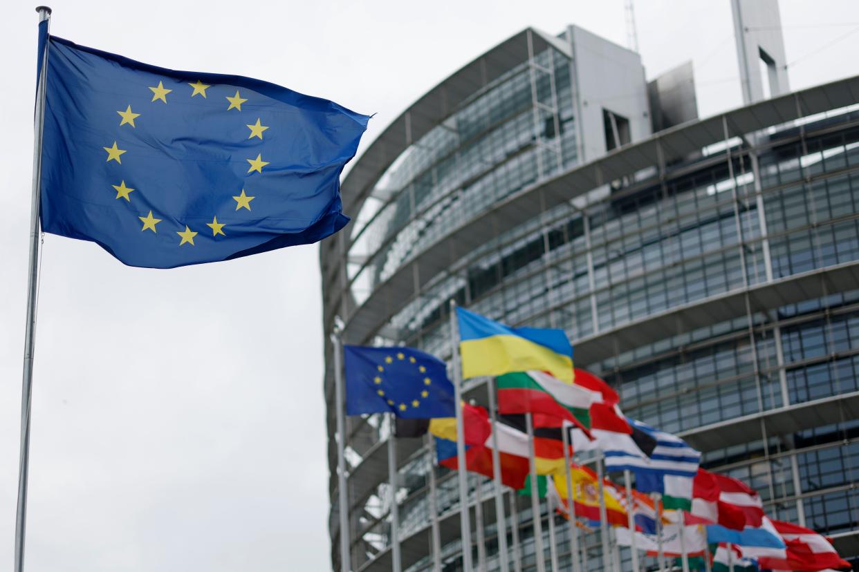 The European flag, left, flies  at the European Parliament in Strasbourg, France (Copyright 2023 The Associated Press. All rights reserved.)