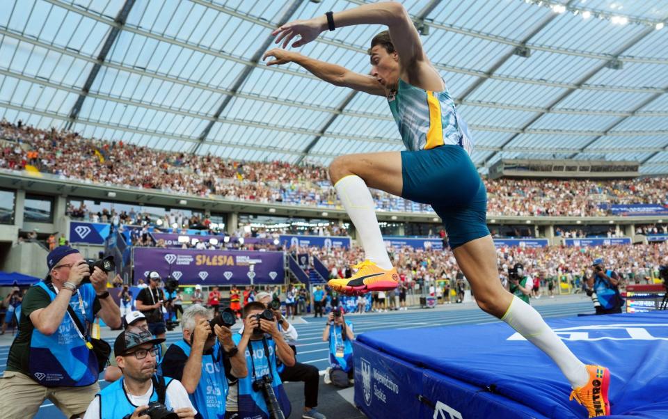 Armand Duplantis celebrates breaking the pole vault world record