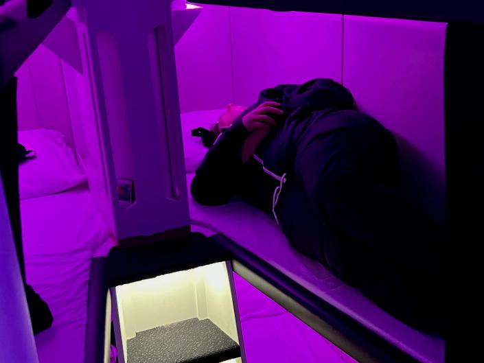 Lying in one of the Skynest bunks.