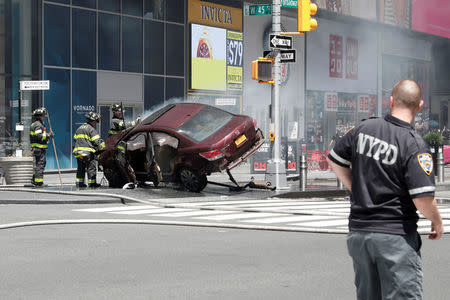 A vehicle that struck pedestrians in Times Square and later crashed is seen on the sidewalk in New York City, May 18, 2017. REUTERS/Mike Segar