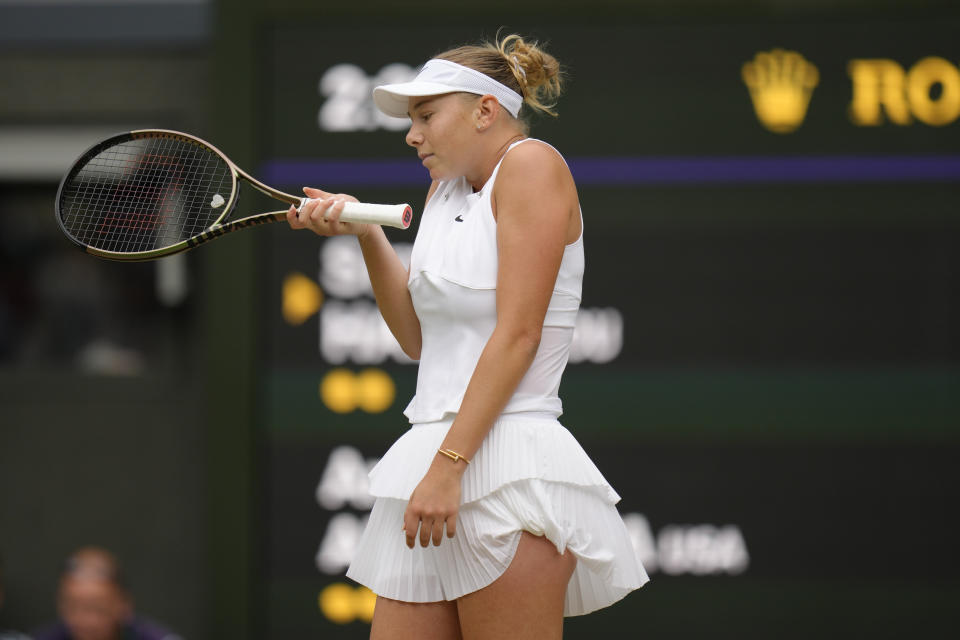 Amanda Anisimova of the US reacts as she plays Romania's Simona Halep in a women's singles quarterfinal match on day ten of the Wimbledon tennis championships in London, Wednesday, July 6, 2022. (AP Photo/Kirsty Wigglesworth)