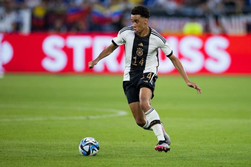 Germany's Jamal Musiala in action during the International Freindly soccer match between Germany and Colombia at Veltins Arena. Rolf Vennenbernd/dpa