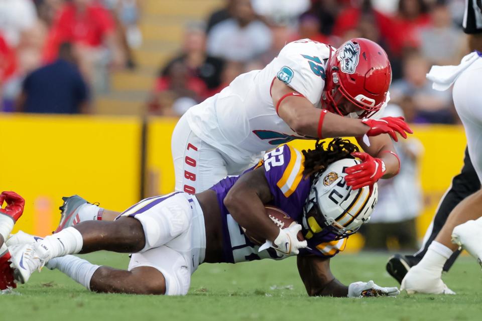 New Mexico linebacker Ale Marenco (18) tackles LSU's Armoni Goodwin (22) during 2022 game in Baton Rouge, La. Marenco has signed to play his senior season at Kansas State in 2024.