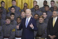 President Joe Biden speaks during an event to present the Commander-in-Chief's Trophy to the United States Military Academy Army Black Knights, in the East Room of the White House, Monday, May 6, 2024, in Washington, as head coach Jeff Monken, right, looks on. (AP Photo/Evan Vucci)