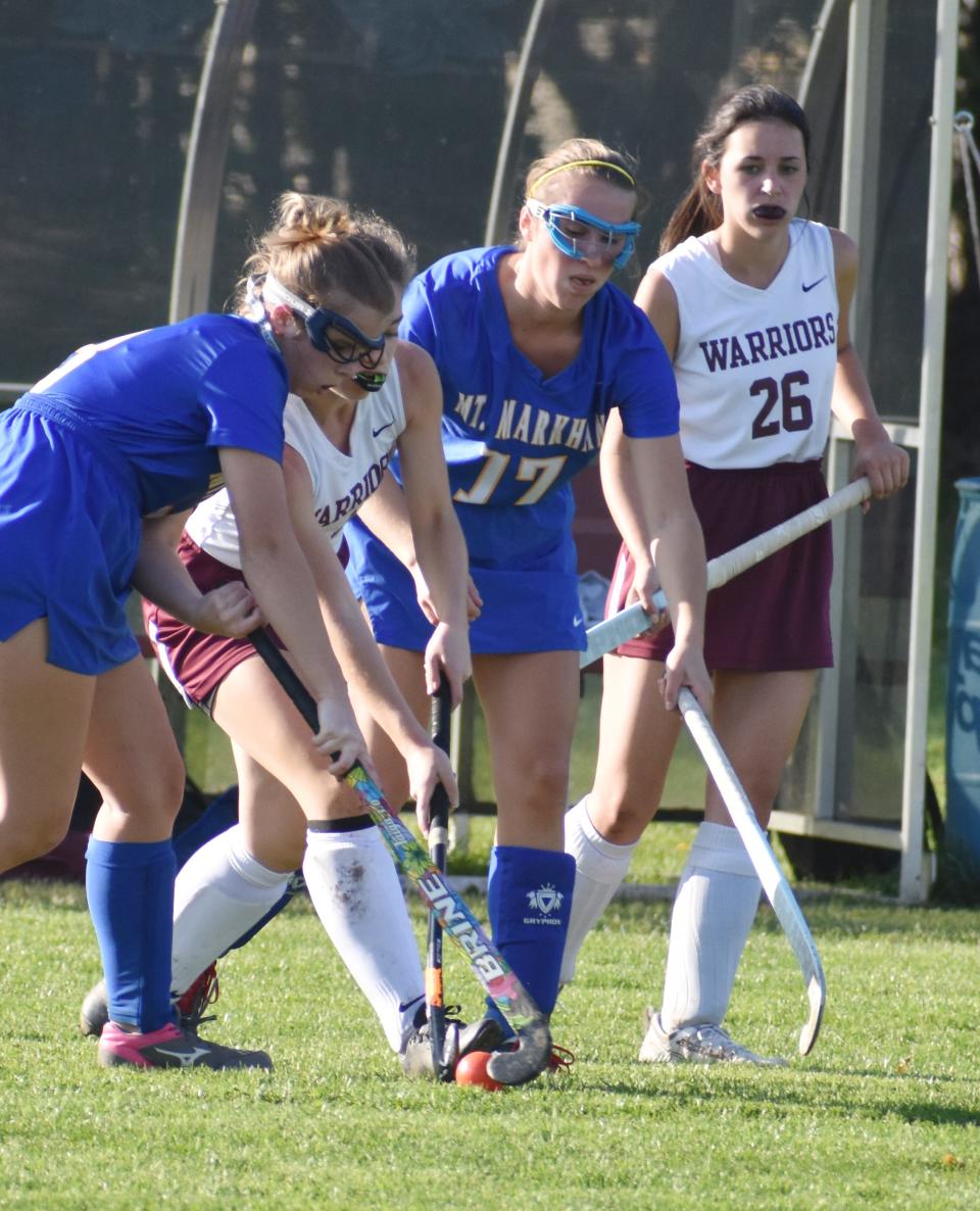 Players from Mount Markham and Clinton jostle for position in a Section III Class C first round field hockey contest on Wednesday, Oct. 20, 2021. Clinton won 2-0 to advance.