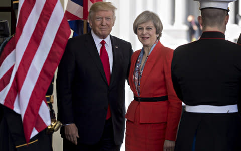 Donald Trump with Theresa May - Credit: Andrew Harrer/Bloomberg