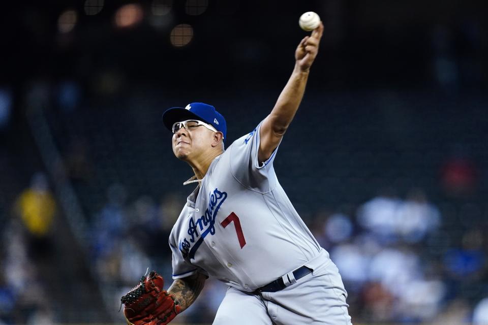 Los Angeles Dodgers starting pitcher Julio Urias throws against the Arizona Diamondbacks during the first inning of a baseball game Sunday, Sept. 26, 2021, in Phoenix. (AP Photo/Ross D. Franklin)