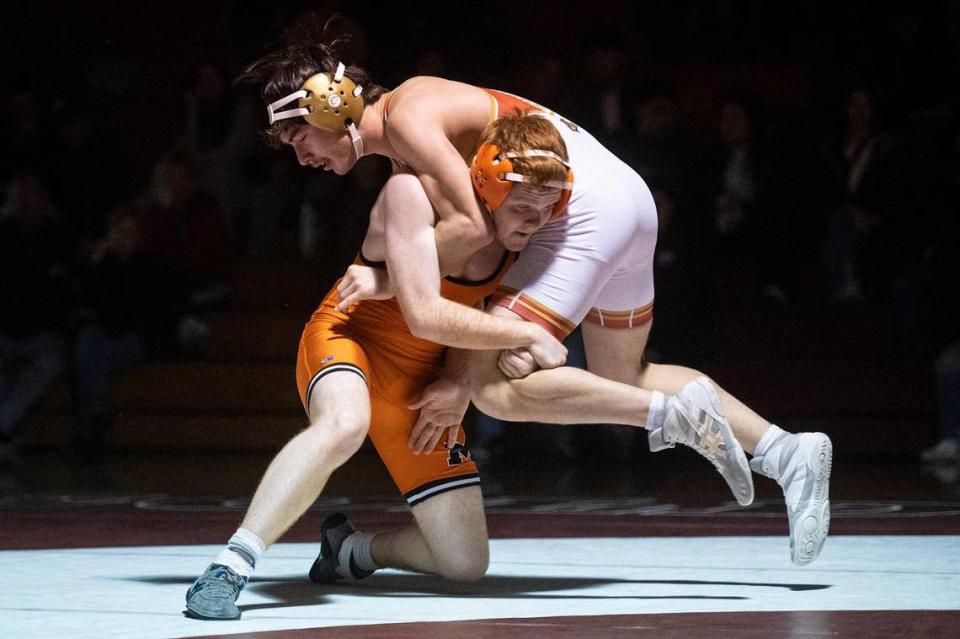 Merced’s Travis Hill wrestles Golden Valley’s Aizen Molina during a match at Golden Valley High School in Merced, Calif., on Tuesday, Jan. 23, 2024.