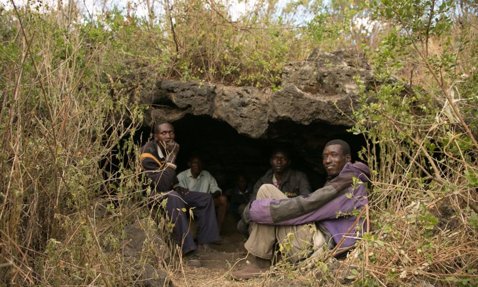 A group of friends&nbsp;in Kenya's&nbsp;remote Utut Forest, where 300 people live in caves.&nbsp;An outbreak of cutaneous leishmaniasis has plagued the local community. (Photo: Zoe Flood)