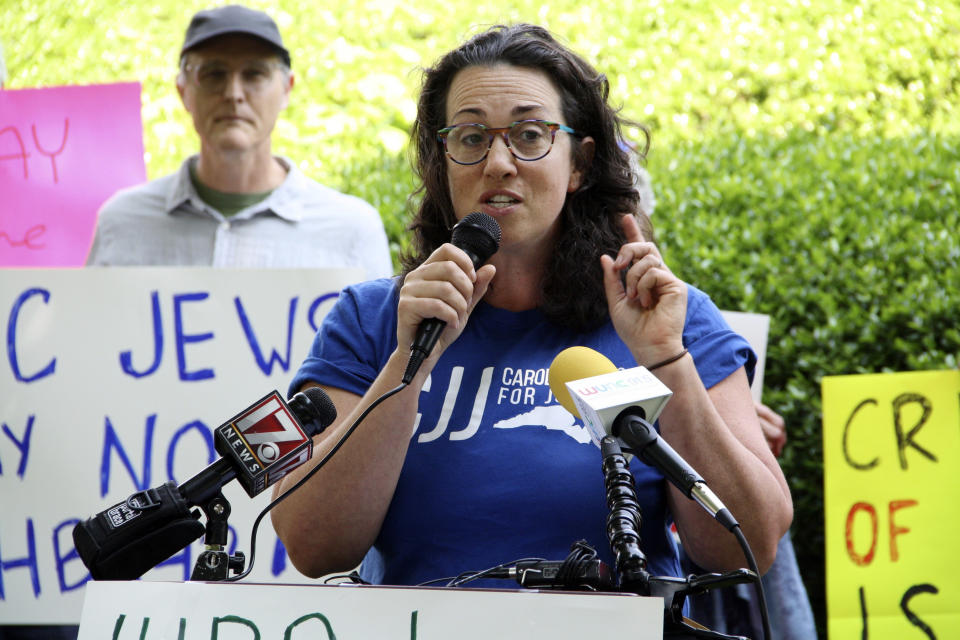 Abby Lublin, the executive director of Carolina Jews for Justice, calls on lawmakers to vote no on the SHALOM Act outside of the Legislative Building in Raleigh, N.C., on Wednesday, May 8, 2024. The bill would add the International Holocaust Remembrance Alliance's definition of antisemitism to state statutes. (AP Photo/Makiya Seminera)