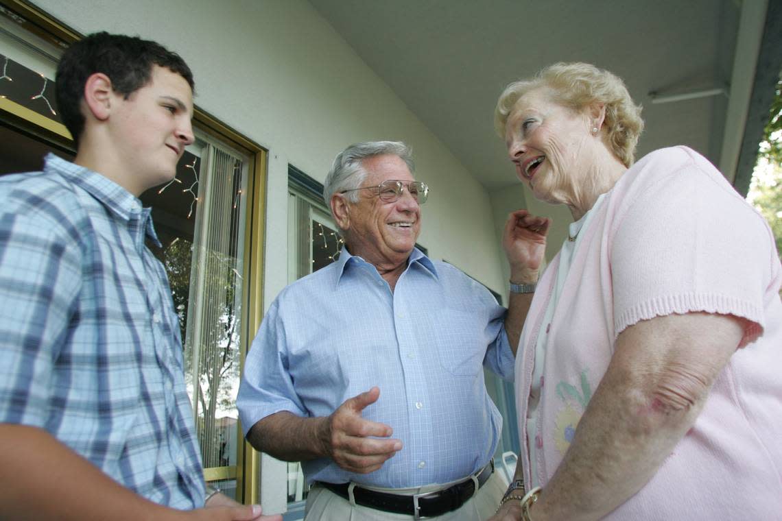 Bob Ferguson, center, of Richland, talks to his wife, Katie, and a grandson before receiving the Sam Volpentest Leadership Award in 2005.