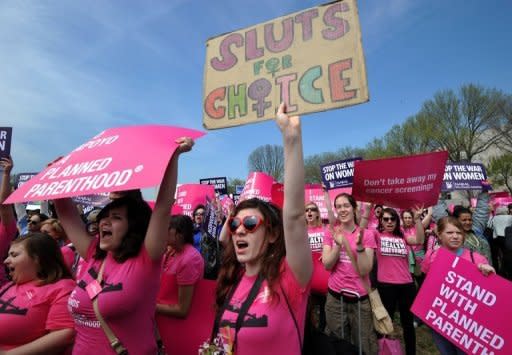 Protesters rally at the National Mall in Washington, DC to show of support for Planned Parenthood, the family-planning group in the crosshairs of the budget battle blazing in Congress, where a federal shutdown is looming. Many Republicans have stressed they want to make organizations that offer abortion services ineligible for federal Title X grants