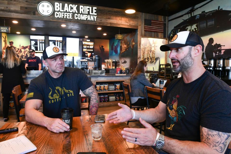 Jarret Johnson (right) and Charlie Keebaugh talk about their Black Rifle Coffee Co. in Niceville. The business opened in September on John Sims Parkway and carries a wide variety of coffees, accessories and clothing.
