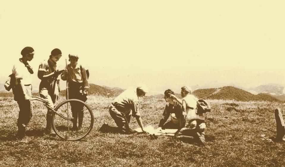 From left, Barbara Ambler Thorne, Jewell King and other members of the Carolina Mountain Club use George Masa’s modified bicycle wheel to measure the Great Smoky Mountains. Masa was a founding member of the club and the club photographer until his death in 1933.