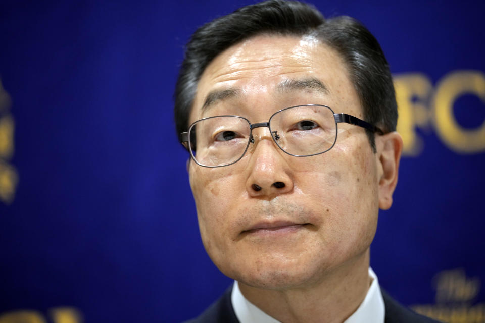 Tomihiro Tanaka, right, the President of Family Federation for World Peace and Unification poses prior to a press conference Wednesday, Aug. 10, 2022, in Tokyo. Tanaka denied any “political interference” with specific political parties and said Prime Minister Kishida’s call for his party members to distance themselves from the church was “regrettable.” Kishida reshuffled his Cabinet on Wednesday in an apparent bid to distance his administration from the Unification Church, whose ties to the assassinated leader Shinzo Abe and senior ruling party leadership caused a major drop in approval ratings. (AP Photo/Eugene Hoshiko)