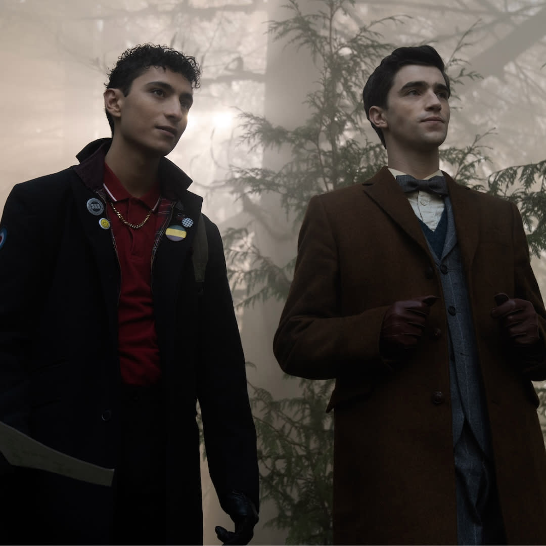  Jayden Revri as Charles Rowland and George Rexstrew as Edwin Payne, standing in a foggy forest, in episode 2 of DEAD BOY DETECTIVES. 