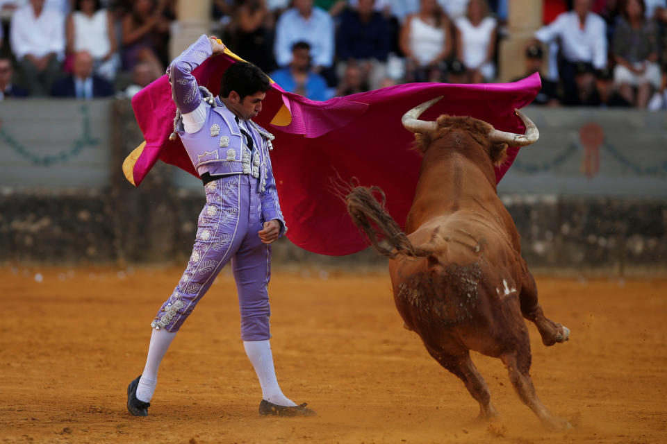 Spanish bullfighter Cayetano Rivera performs a pass to a bull during a “Corrida Goyesca” bullfight in Ronda, southern Spain, September 2, 2017. REUTERS/Jon Nazca