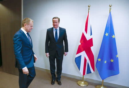 British Prime Minister David Cameron (R) and European Council President Donald Tusk attend a bilateral meeting ahead of a European Union leaders summit addressing the talks about the so-called Brexit and the migrants crisis, in Brussels, Belgium, February 18, 2016. REUTERS/Yves Herman