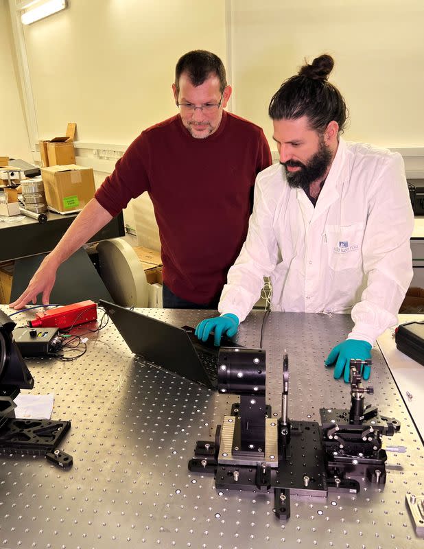 Astrophysicist Avishay Gal-Yam and researcher Ido Irani look at a screen in their laboratory at the Weizmann Institute of Science in Rehovot