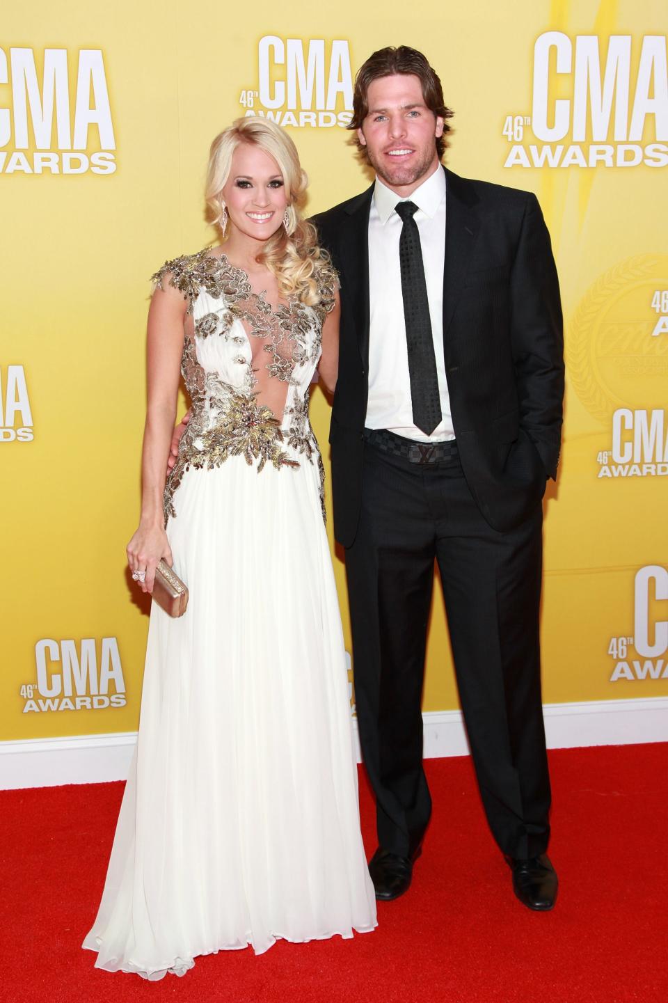 Country music artist Carrie Underwood and Mike Fisher attend the 46th annual CMA Awards