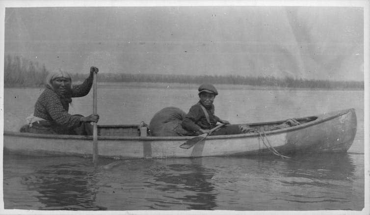 A mother and son in a canoe