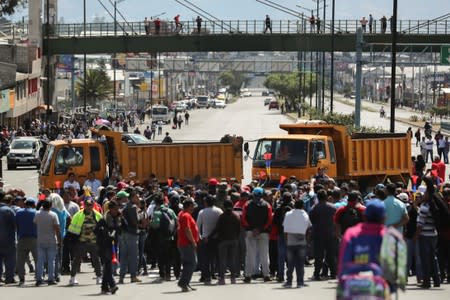 Trucks block main roads during protests after Ecuador's President Lenin Moreno's government ended four-decade-old fuel subsidies, in Carapungo, near Quito