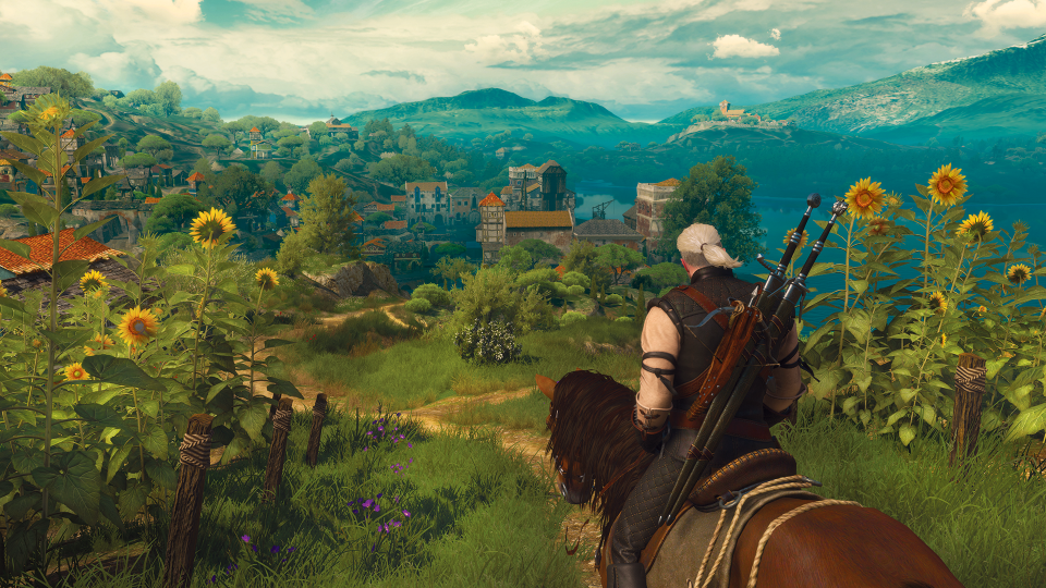 Geralt rides his horse through a field of sunflowers in the Witcher 3