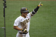 San Diego Padres' Ha-Seong Kim (7) points skyward after hitting a solo home run during the second inning of a baseball game against the St. Louis Cardinals, Saturday, May 15, 2021, in San Diego. (AP Photo/Denis Poroy)