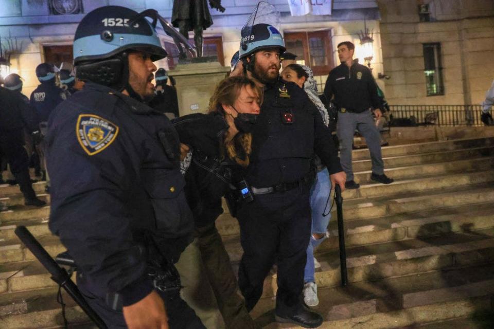 NEW YORK, UNITED STATES - APRIL 30: New York Police Department officers enter the Columbia University building and detain pro-Palestinian demonstrators as they had barricaded themselves to iconic Hamilton Hall building in New York, United States on April 30, 2024. Over 100 people arrested according to reports. (Photo by Selcuk Acar/Anadolu via Getty Images)