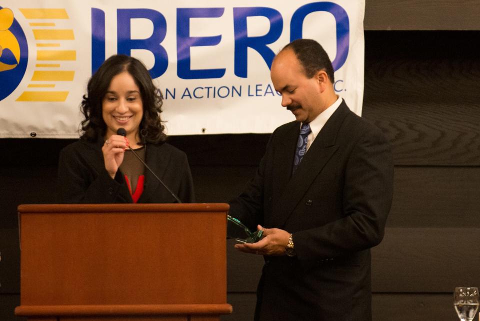 In this file photo from 2014, Juana L. Vega receives the Ibero Alicia Torres Award from Ibero Board then-President Juan Lugo.