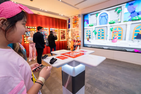 In this photo provided by Nintendo of America, the newly released pastel pink Joy-Con controllers make their debut alongside Princess Peach: Showtime! At the launch ceremony held at the Nintendo New York Store in Rockefeller Center.