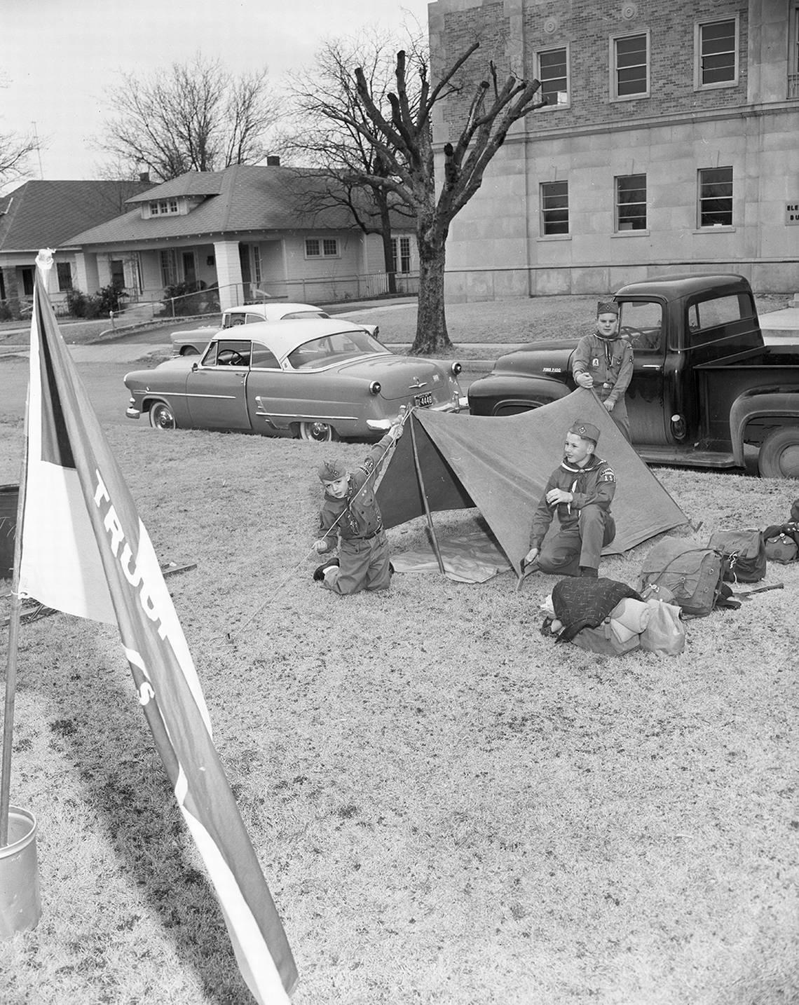 Feb. 7, 1959: Starting off Boy Scout week on Saturday by exhibiting camping skills, three scouts pitch a tent on the parkway of Circle Park Boulevard. They are, left to right, Joe Moore of 2902 North West 26th, Roy Messick of 2717 North West 31st and Eugene Johnson of 2817 North West 29th. Fort Worth Star-Telegram archive/UT Arlington Special Collections