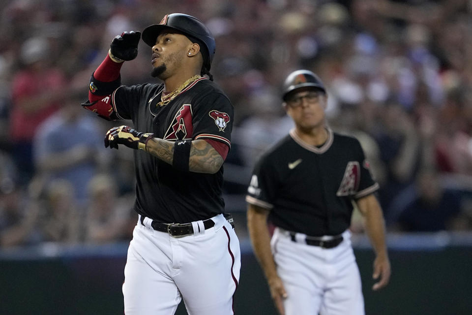 Arizona Diamondbacks' Ketel Marte (4) celebrates his solo home run against the Boston Red Sox during the first inning of a baseball game, Saturday, May 27, 2023, in Phoenix. (AP Photo/Matt York)