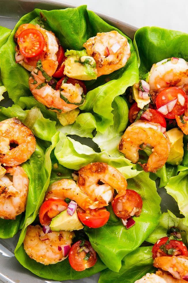 <p>Lettuce wraps are the one of the best ways to eat healthy (and low carb). These wraps are stuffed with our new favourite twist on prawn salad: basil avocado.</p><p>Get the <a href="https://www.delish.com/uk/cooking/recipes/a34959586/avocado-shrimp-salad-lettuce-wraps-recipe/" rel="nofollow noopener" target="_blank" data-ylk="slk:Basil Avocado Prawn Salad Wraps" class="link ">Basil Avocado Prawn Salad Wraps</a> recipe.</p>