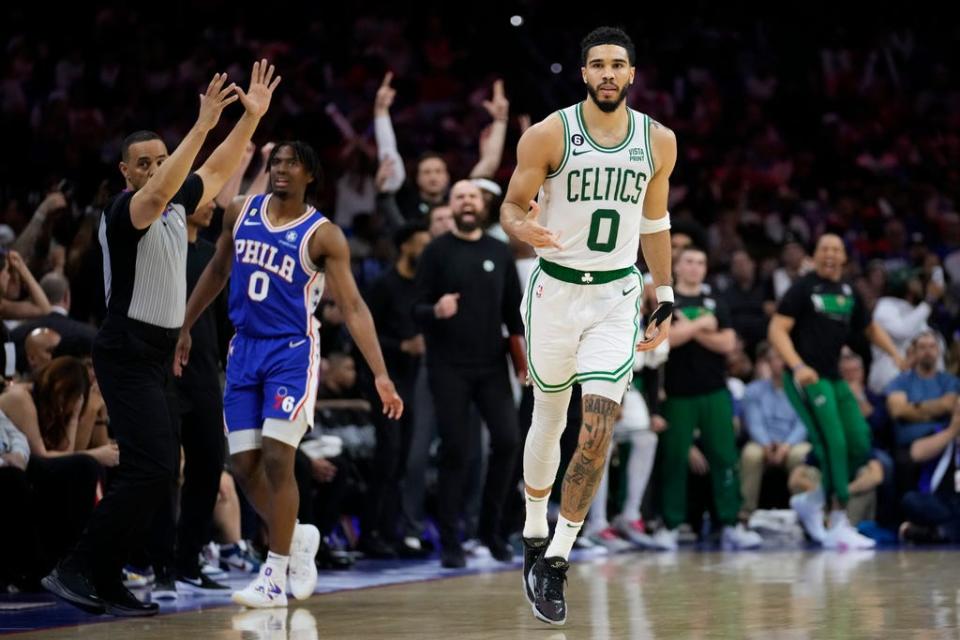 Boston Celtics' Jayson Tatum runs past Philadelphia 76ers' Tyrese Maxey after a basket during the second half of Game 6 of an NBA basketball playoffs Eastern Conference semifinal, Thursday, May 11, 2023, in Philadelphia. (AP Photo/Matt Slocum)