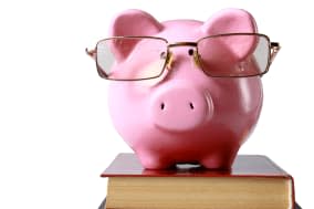 piggy bank with glasses and...