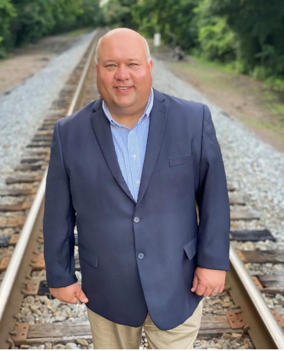 a man standing on train tracks