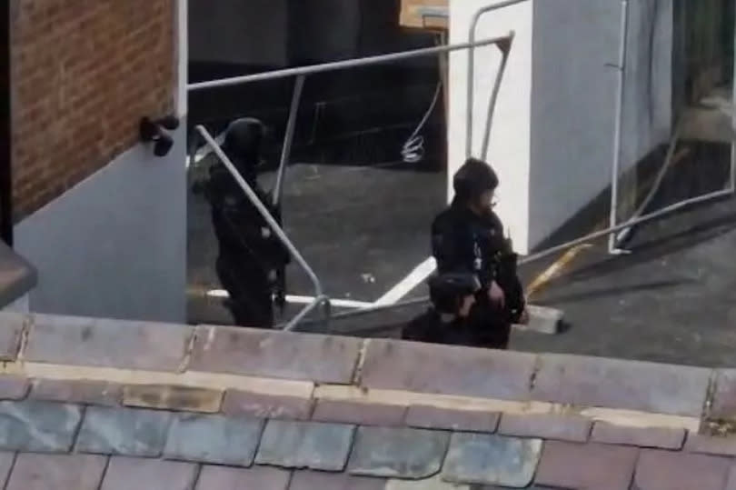 Armed police on Taliesin Street, Llandudno